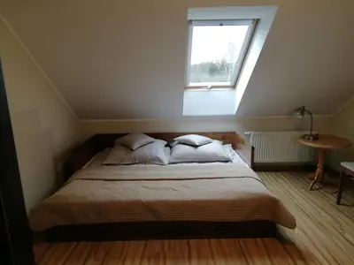 Łóżko lub łóżka w pokoju w obiekcie Zofijówka