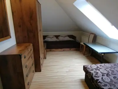 Łóżko lub łóżka w pokoju w obiekcie Zofijówka