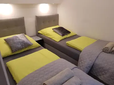 Łóżko lub łóżka w pokoju w obiekcie Apartamenty u Sikory
