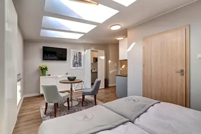 Łóżko lub łóżka w pokoju w obiekcie Joyinn Aparthotel