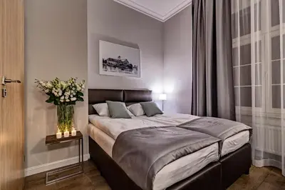 Łóżko lub łóżka w pokoju w obiekcie Joyinn Aparthotel