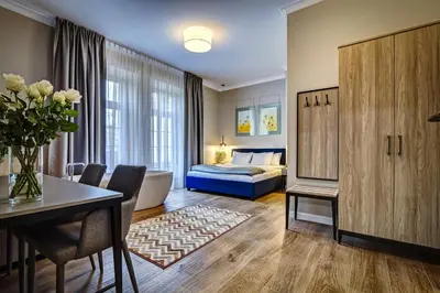 Łóżko lub łóżka w pokoju w obiekcie Joyinn Aparthotel