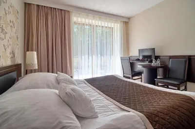 Łóżko lub łóżka w pokoju w obiekcie Hotel Zacisze