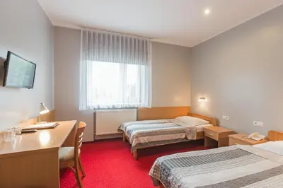 Łóżko lub łóżka w pokoju w obiekcie HOTEL ŁABĘDY i Hostel Łabędy