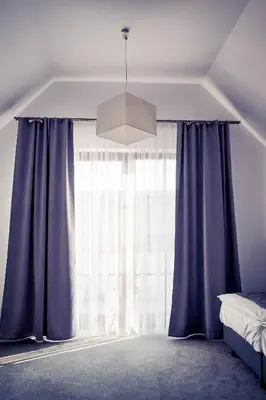 Łóżko lub łóżka w pokoju w obiekcie Hotel Pałac Krotoszyce Basen&Spa
