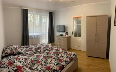 Łóżko lub łóżka w pokoju w obiekcie Apartamenty Pod Lwami