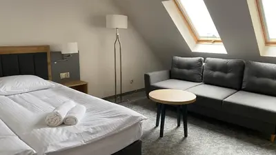 Łóżko lub łóżka w pokoju w obiekcie Willa Puchaczówka
