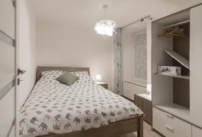 Łóżko lub łóżka w pokoju w obiekcie Apartamenty W Starym Ogrodzie