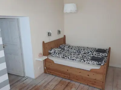 Łóżko lub łóżka w pokoju w obiekcie Apartament Zwycięstwa