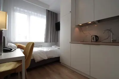 Łóżko lub łóżka w pokoju w obiekcie Hotel Coliber