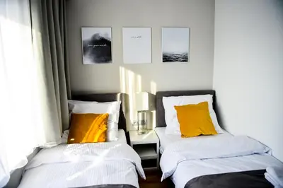Łóżko lub łóżka w pokoju w obiekcie Hotel Coliber