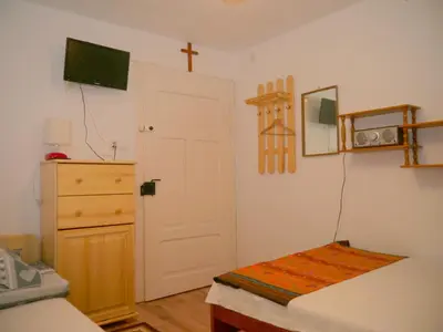 Łóżko lub łóżka w pokoju w obiekcie Pod kasztanem gospodarstwo agroturystyczne