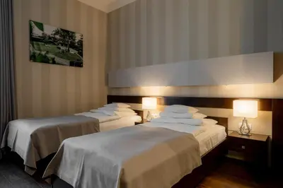 Łóżko lub łóżka w pokoju w obiekcie Hotel Salve
