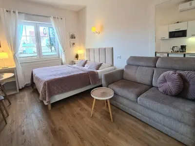 Łóżko lub łóżka w pokoju w obiekcie APARTAMENTY 