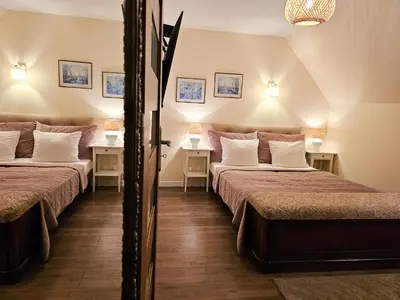 Łóżko lub łóżka w pokoju w obiekcie APARTAMENTY 