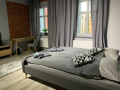 Łóżko lub łóżka w pokoju w obiekcie Browarna 1 Apartamenty przy Rynku Racibórz