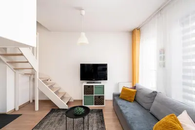 Telewizja i/lub zestaw kina domowego w obiekcie A.S. HOME Kościuszki Apartament dwupoziomowy
