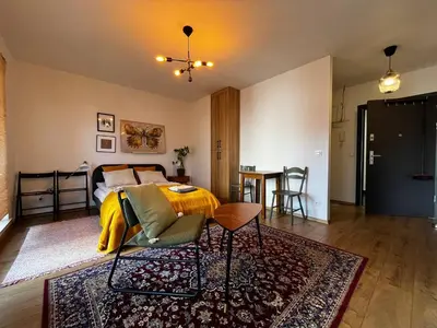Łóżko lub łóżka w pokoju w obiekcie Dmowskiego 13 Tectum Apartments