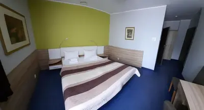 Łóżko lub łóżka w pokoju w obiekcie Hotel Arsenał