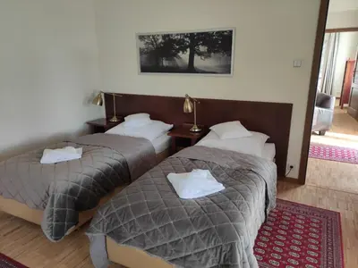 Łóżko lub łóżka w pokoju w obiekcie Jasny Dwór