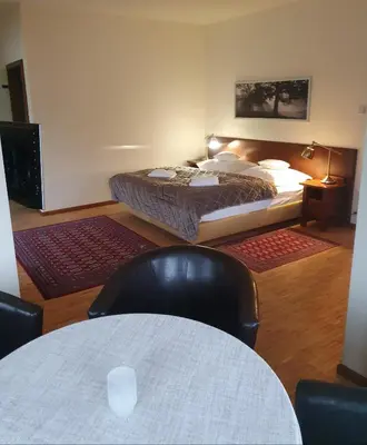 Łóżko lub łóżka w pokoju w obiekcie Jasny Dwór