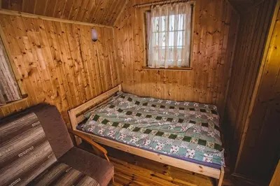 Łóżko lub łóżka w pokoju w obiekcie Janowa Chata