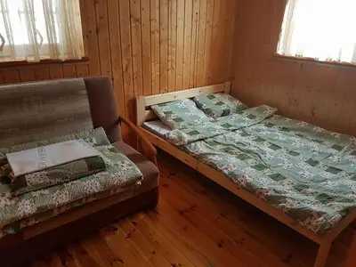 Łóżko lub łóżka w pokoju w obiekcie Janowa Chata
