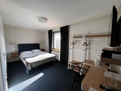 Łóżko lub łóżka w pokoju w obiekcie Hotel Marta