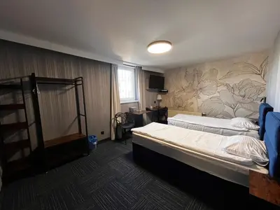 Łóżko lub łóżka w pokoju w obiekcie Hotel Marta