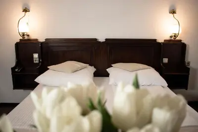 Łóżko lub łóżka w pokoju w obiekcie Hotel Dwór Polski