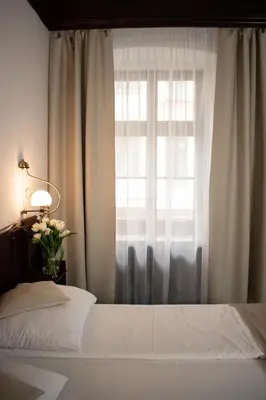 Łóżko lub łóżka w pokoju w obiekcie Hotel Dwór Polski