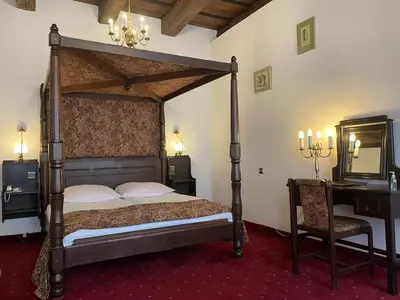 Łóżko lub łóżka w pokoju w obiekcie Hotel Dwór Polski