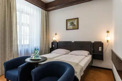 Łóżko lub łóżka w pokoju w obiekcie Hotel Dwór Polski