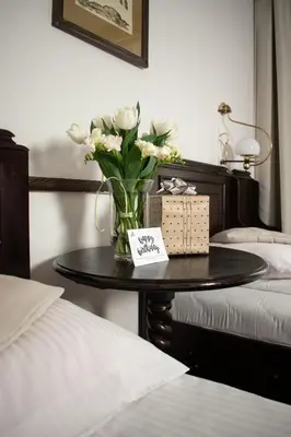 Łóżko lub łóżka w pokoju w obiekcie Hotel Dwór Polski