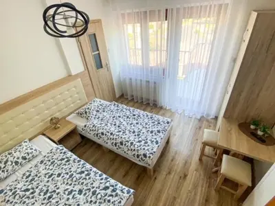 Łóżko lub łóżka w pokoju w obiekcie Pokoje gościnne Anna