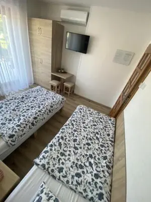 Łóżko lub łóżka w pokoju w obiekcie Pokoje gościnne Anna