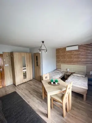 Łóżko lub łóżka w pokoju w obiekcie Pokoje gościnne Anna