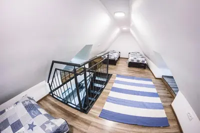 Łóżko lub łóżka w pokoju w obiekcie Villa Tower Nad Jeziorem Nyskim