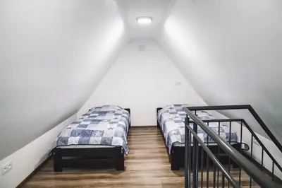 Łóżko lub łóżka w pokoju w obiekcie Villa Tower Nad Jeziorem Nyskim
