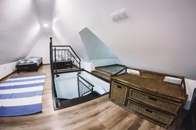 Łóżko lub łóżka w pokoju w obiekcie Villa Tower Nad Jeziorem Nyskim