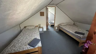 Łóżko lub łóżka w pokoju w obiekcie Domek Adusiówka