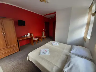 Łóżko lub łóżka w pokoju w obiekcie Willa Romantika