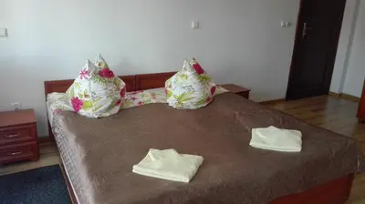 Łóżko lub łóżka w pokoju w obiekcie Willa Romantika