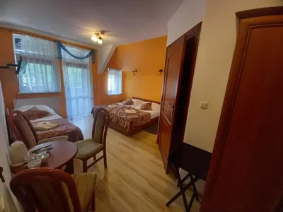 Łóżko lub łóżka w pokoju w obiekcie Willa Romantika