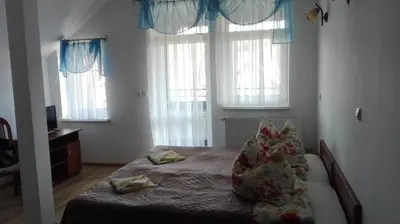Łóżko lub łóżka w pokoju w obiekcie Willa Romantika