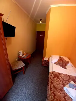Łóżko lub łóżka w pokoju w obiekcie Willa Romantika