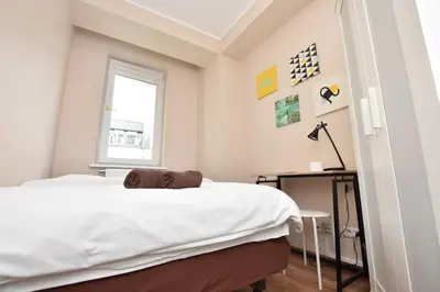Łóżko lub łóżka w pokoju w obiekcie DUKES ApartHostel - pokoje prywatne, RYNEK