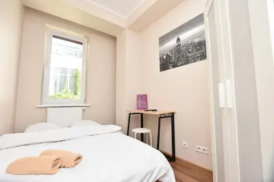 Łóżko lub łóżka w pokoju w obiekcie DUKES ApartHostel - pokoje prywatne, RYNEK