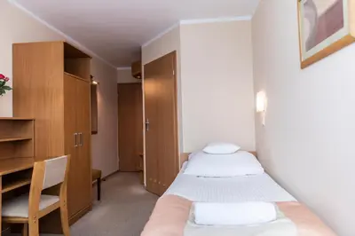 Łóżko lub łóżka w pokoju w obiekcie Ziemowit