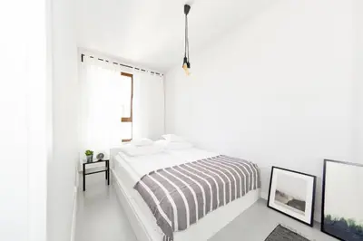 Łóżko lub łóżka w pokoju w obiekcie BatogoSpot Towers